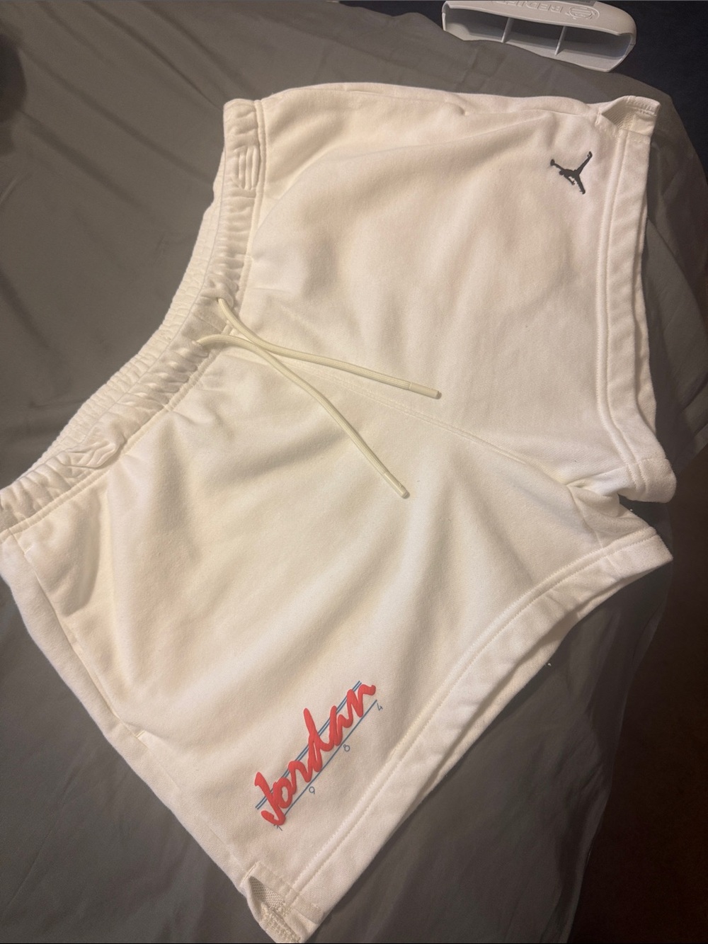 Jordan Women’s White Athletic Fleece Shorts with Red Script Logo